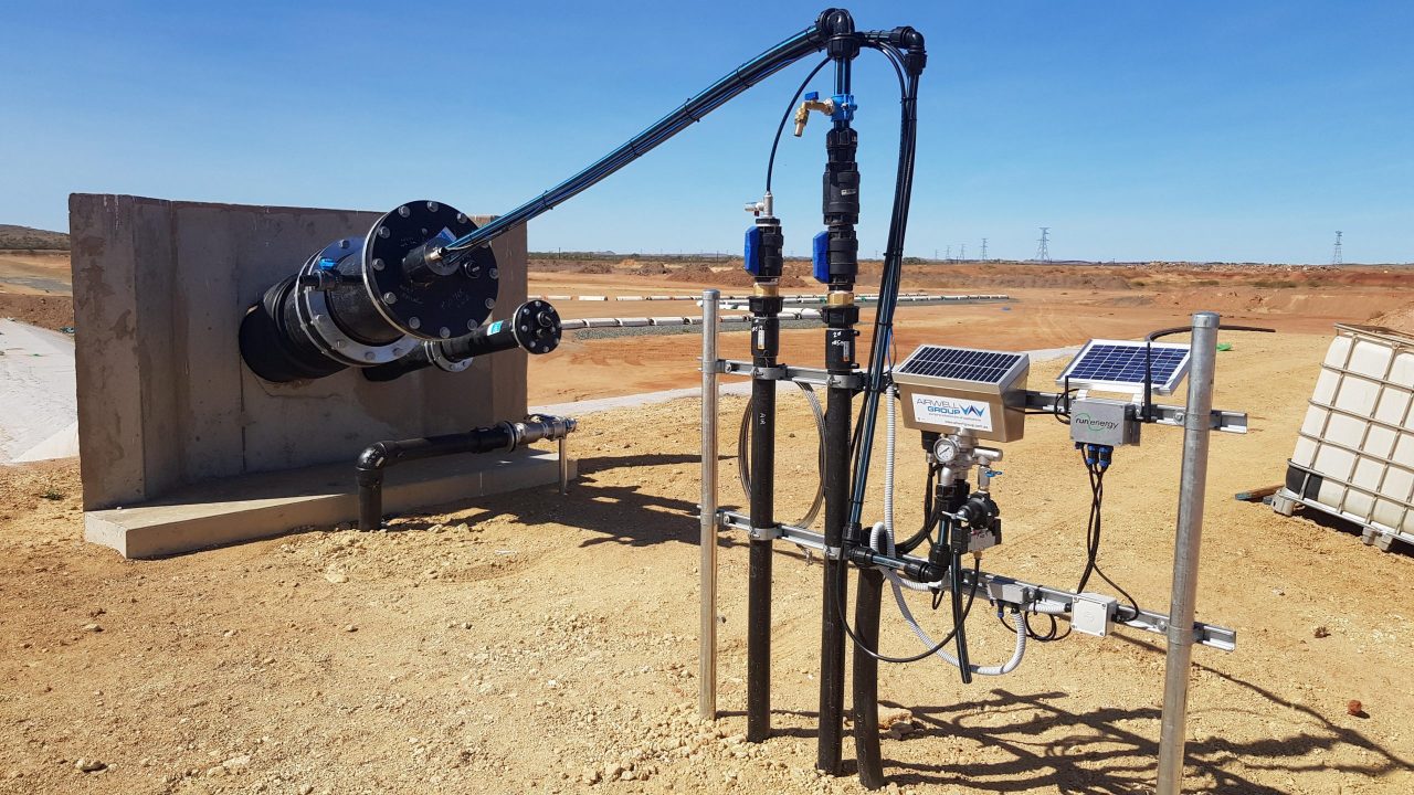 RunEnergy FieldTech monitoring unit installed beside a remote groundwater pump